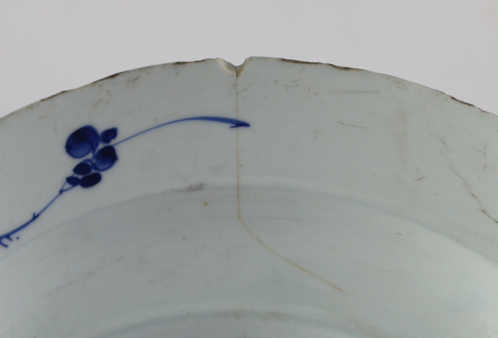 A Chinese blue and white panelled dish, Kangxi period, 36.5cm diameter, rim chip with hairline crack